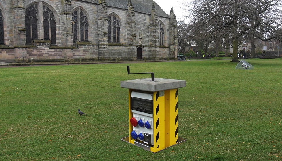 A retractable service unit by Pop Up Power Supplies installed in a sensitive setting within the Aberdeen University campus.